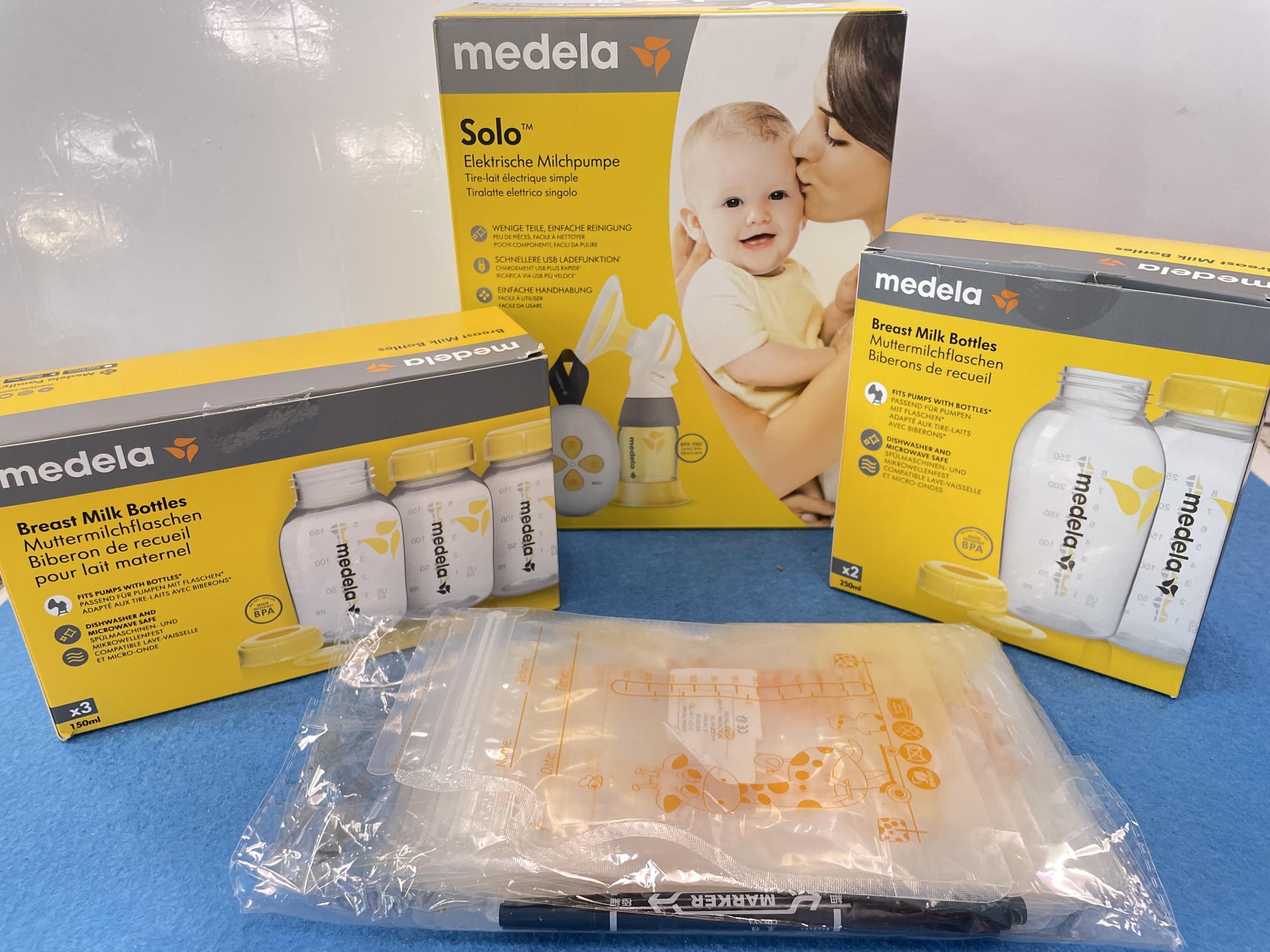 tiralatte elettrico ricaricabile  medela con accessori e contenitori + sacche porta latte